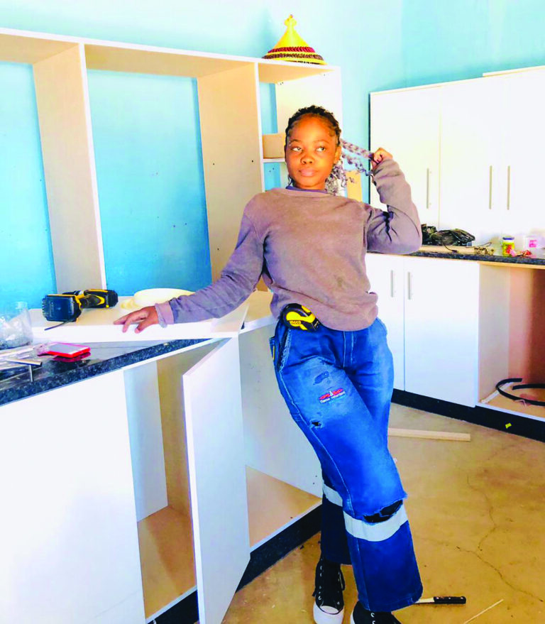 Young female carpenter redefines gender roles