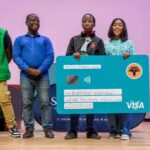 Lesotho Science & Mathematics Teaching Association (LSMTA) and FNB representatives present an award to top-achieving student Katiso Katiba at the 2026 awards ceremony