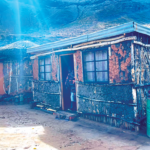 The home of a beneficiary family nestled in the mountainous terrain of the Quthing district
